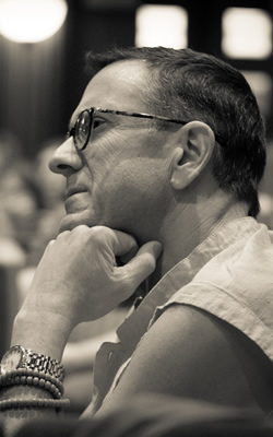 image of Lama Yeshe Jinpa sitting pensively with his hand under his chin